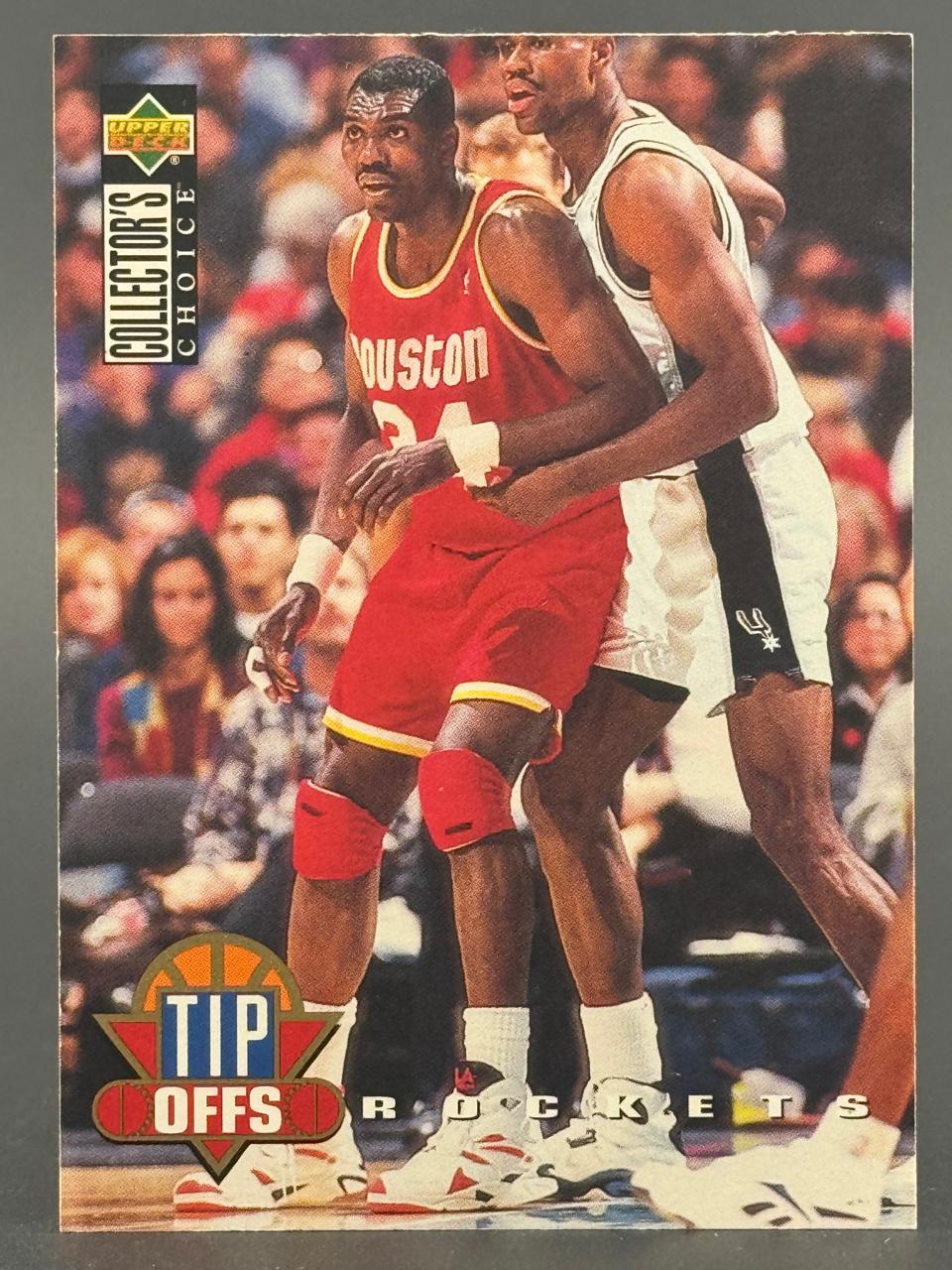 1994-95 Upper Deck Collector's Choice Tip Offs basketball card featuring Hakeem Olajuwon.