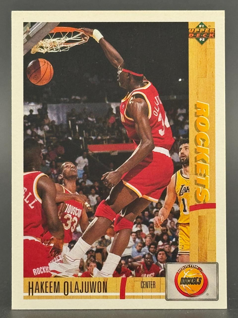 1991-92 Upper Deck Hakeem Olajuwon basketball card #35, showing him dunking.