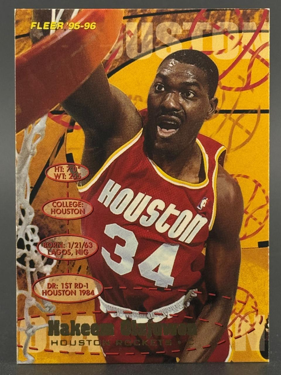 1995-96 Fleer Hakeem Olajuwon Houston Rockets basketball card dunking.