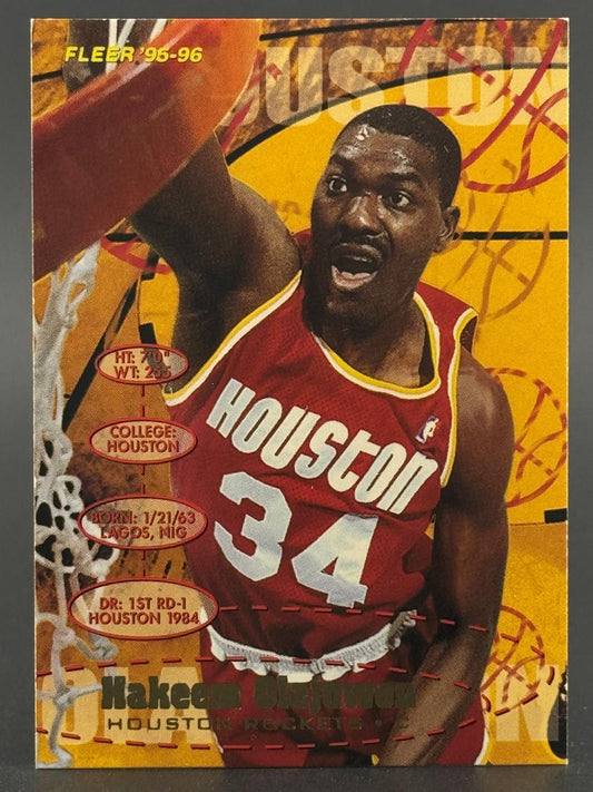 1995-96 Fleer Hakeem Olajuwon Houston Rockets basketball card dunking.