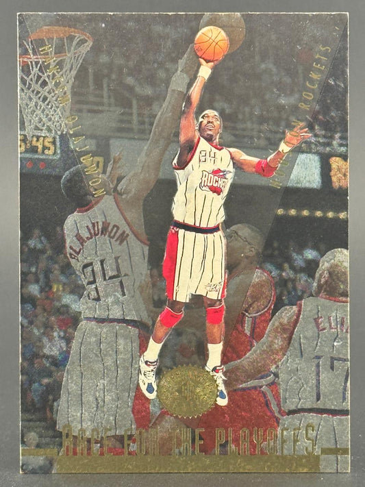 Hakeem Olajuwon 1996 SP Race for the Playoffs basketball card showing him shooting.