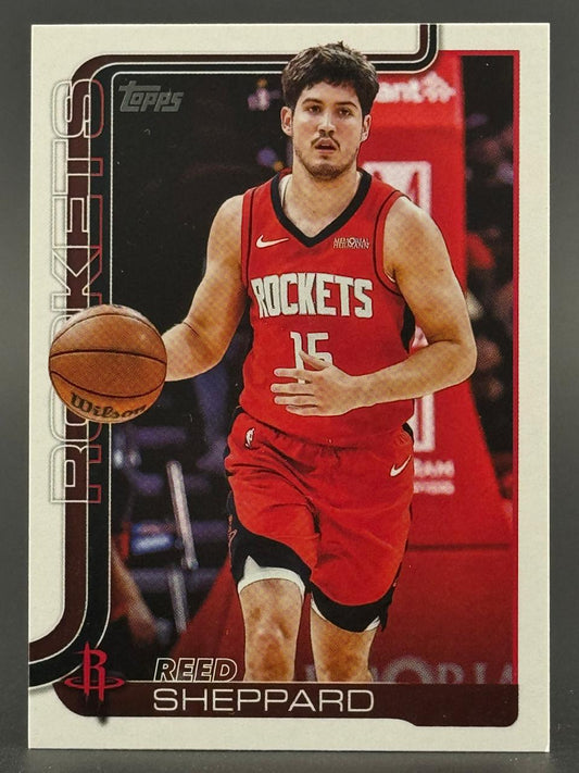 Reed Sheppard trading card, Topps Rockets, dribbling a basketball in a red uniform.