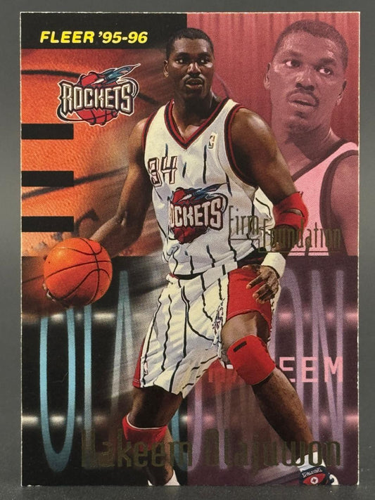 1995-96 Fleer Hakeem Olajuwon basketball card, #34 in Rockets uniform.