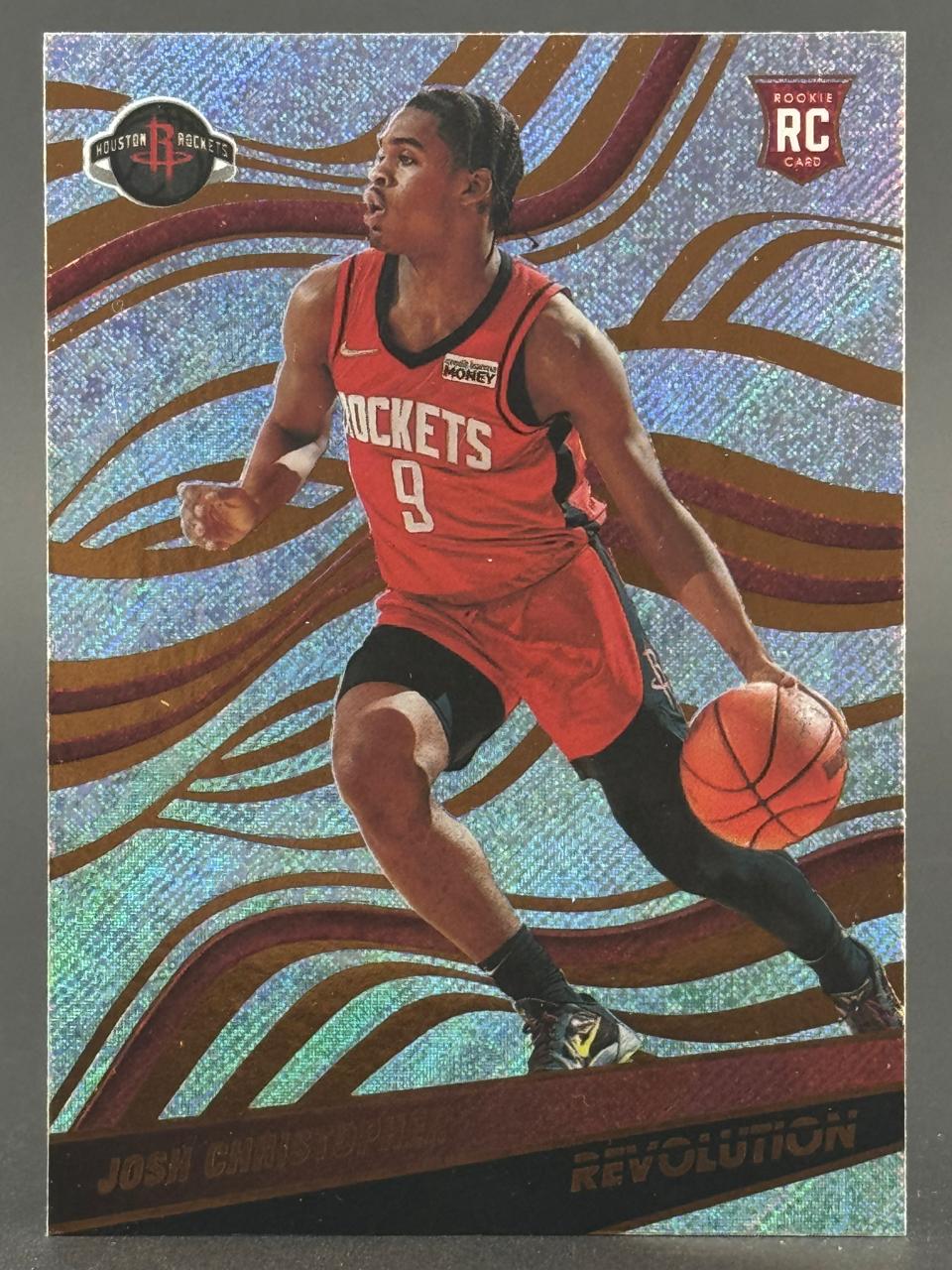Josh Christopher 2021-22 Panini Revolution Rookie trading card dribbling a basketball.
