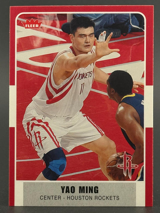 Yao Ming Fleer basketball card, showing him defending an opponent on the court.