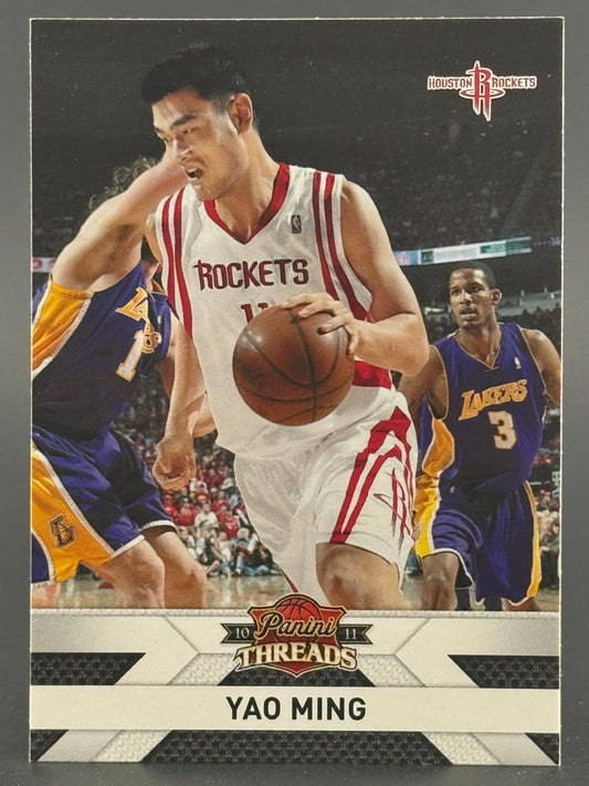 2010-11 Panini Threads Yao Ming basketball card featuring Ming dribbling against Lakers players.