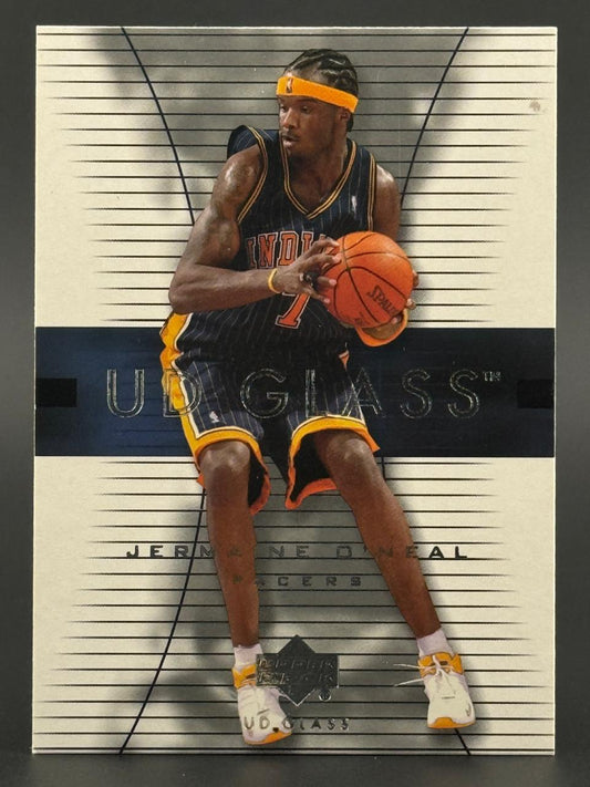 Jermaine O'Neal holding a basketball on a UD Glass trading card, wearing Indiana Pacers jersey and headband.