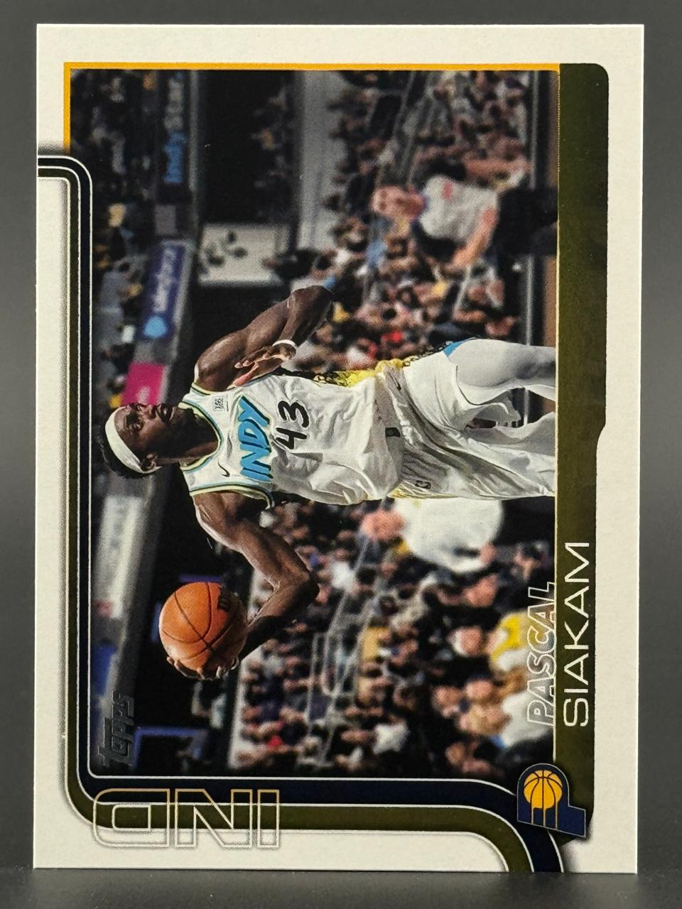 Trading card featuring Pascal Siakam dribbling a basketball in an arena.