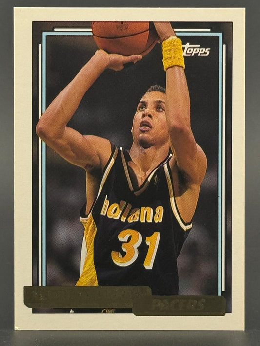Trading card of Reggie Miller, Indiana Pacers, shooting a basketball.