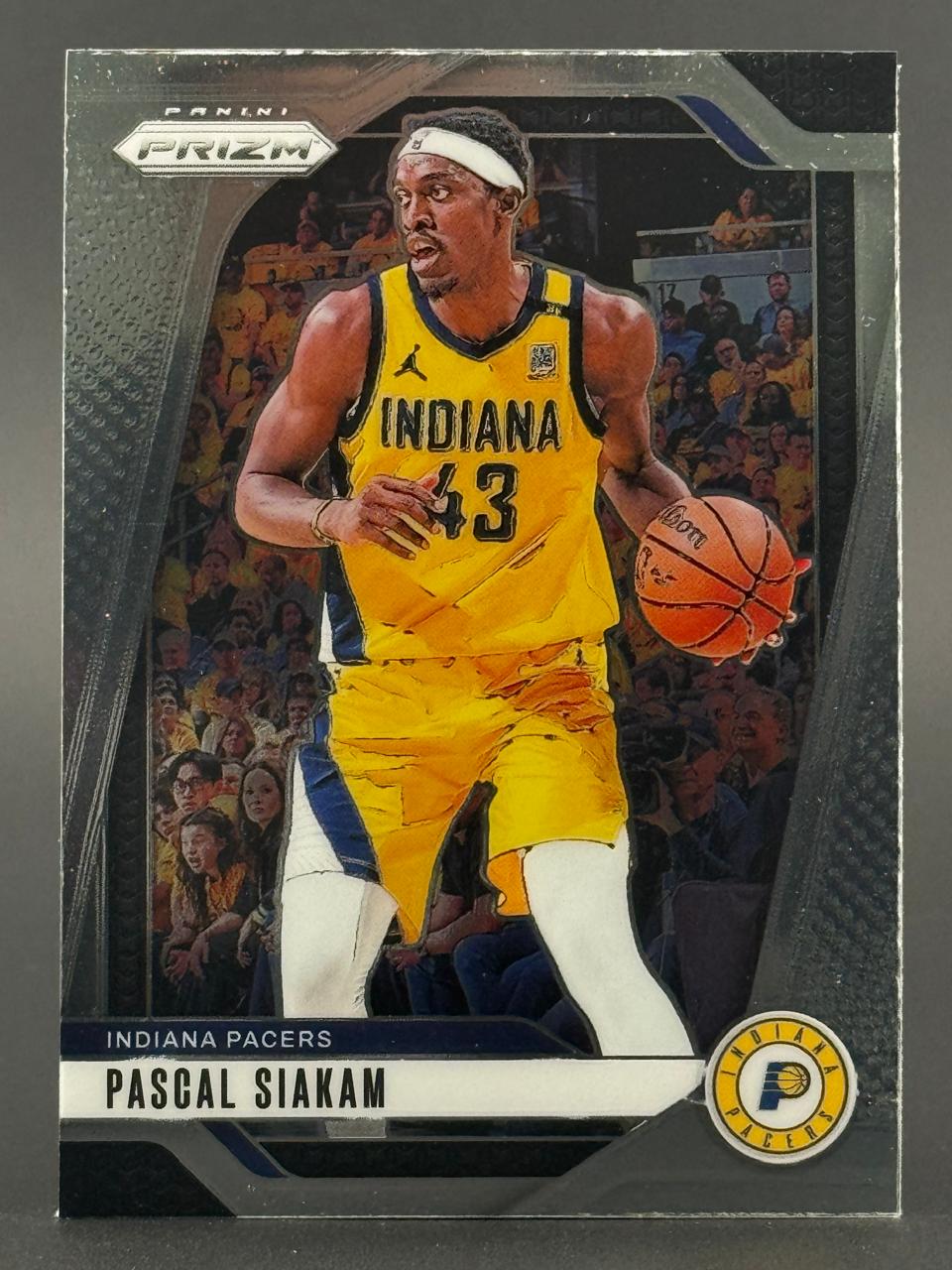 Pascal Siakam trading card from Panini Prizm, featuring him in an Indiana Pacers uniform dribbling a basketball.