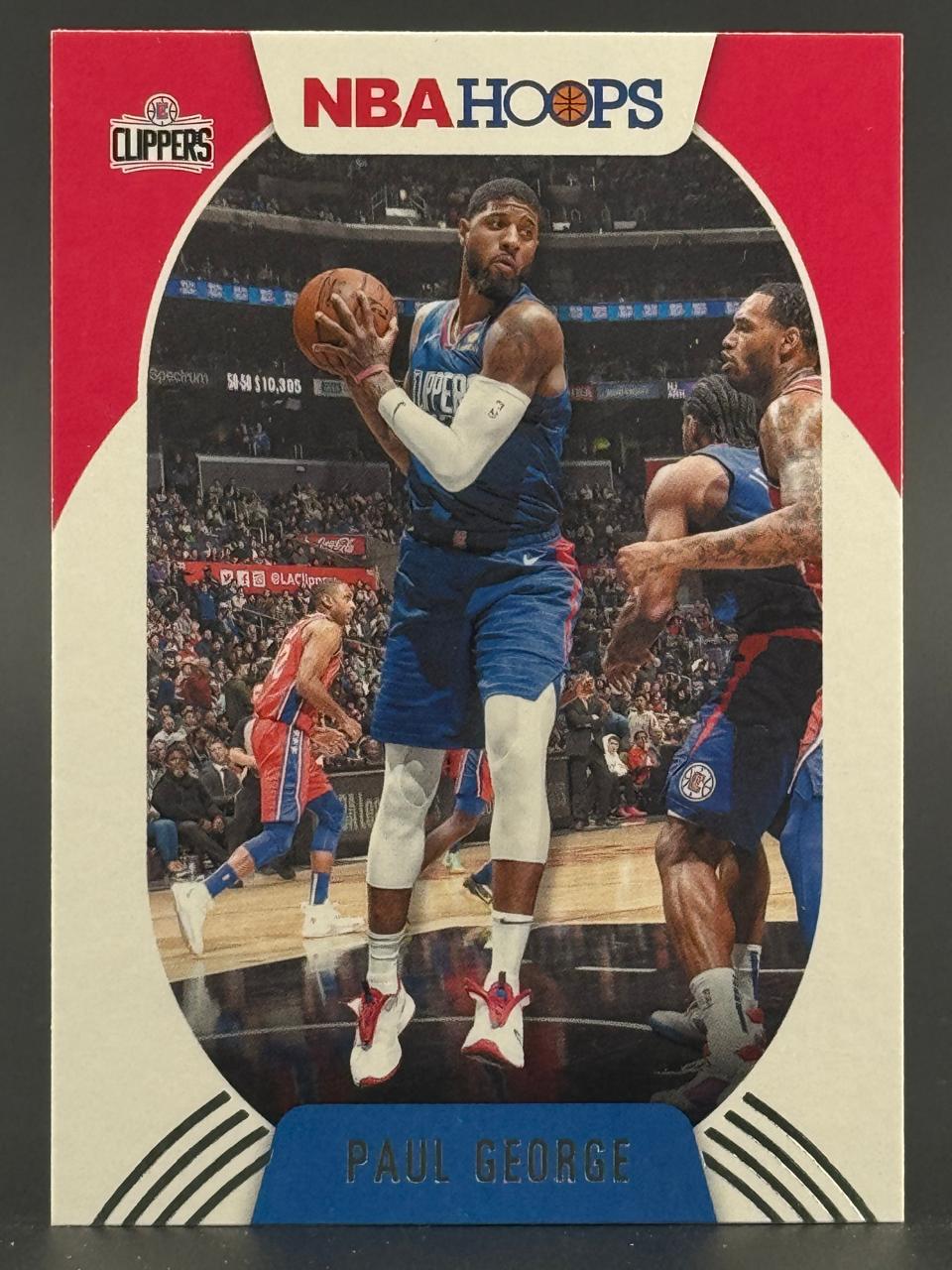 Paul George 2019-20 NBA Hoops basketball trading card.