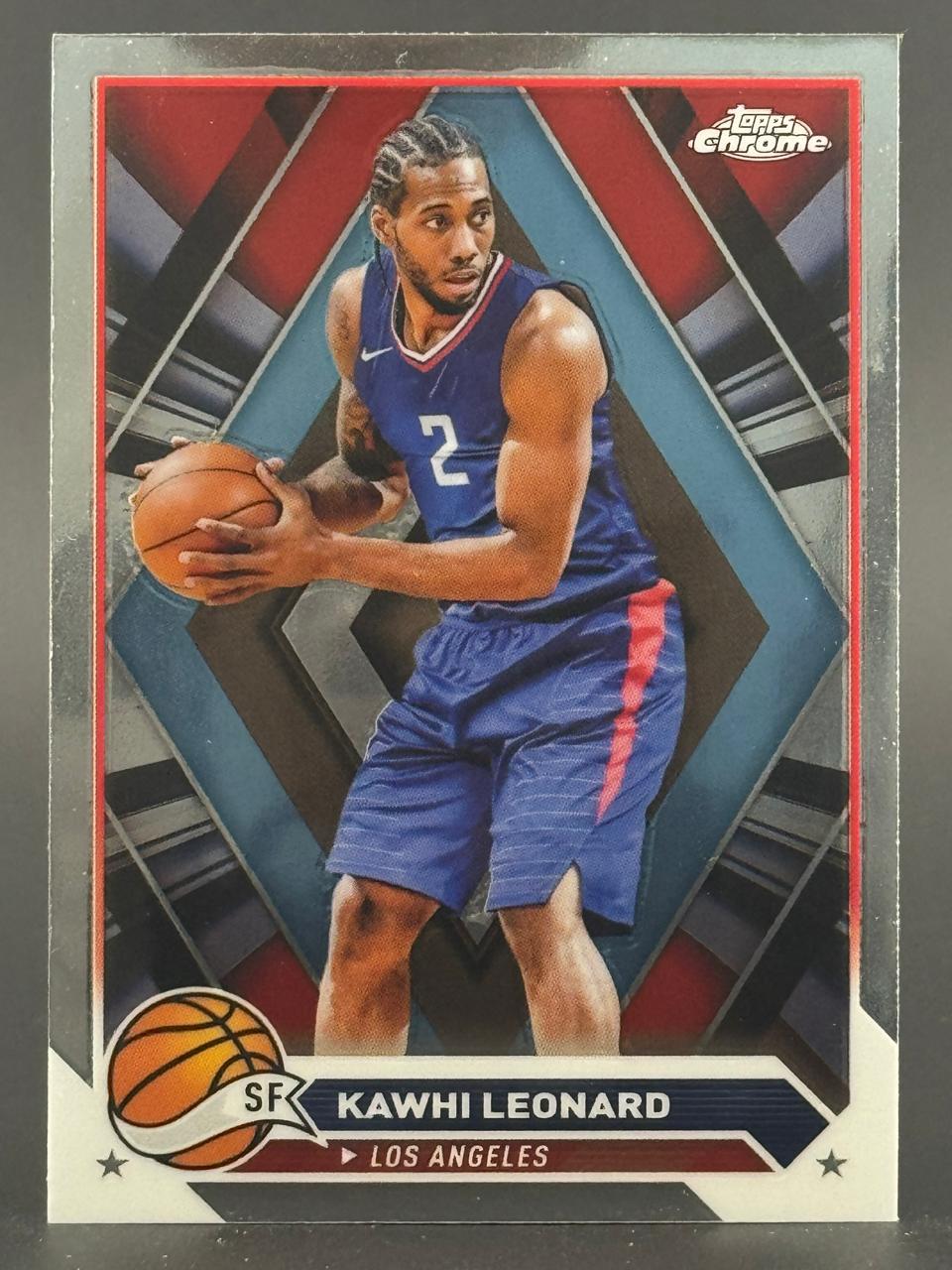 Kawhi Leonard trading card, Topps Chrome basketball, holding a basketball.