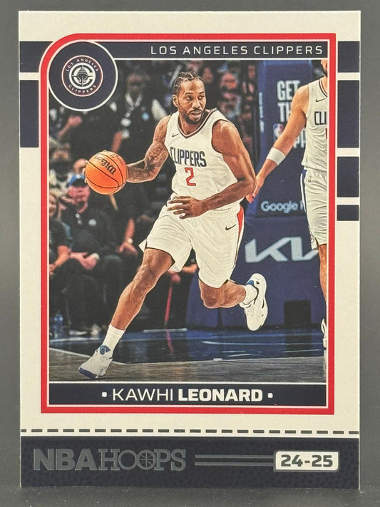 24-25 NBA Hoops Kawhi Leonard trading card featuring him dribbling in a Los Angeles Clippers uniform.