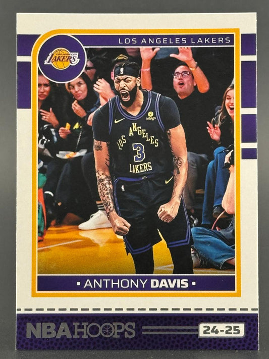 24-25 NBA Hoops Anthony Davis trading card, featuring Davis roaring in a Los Angeles Lakers uniform.