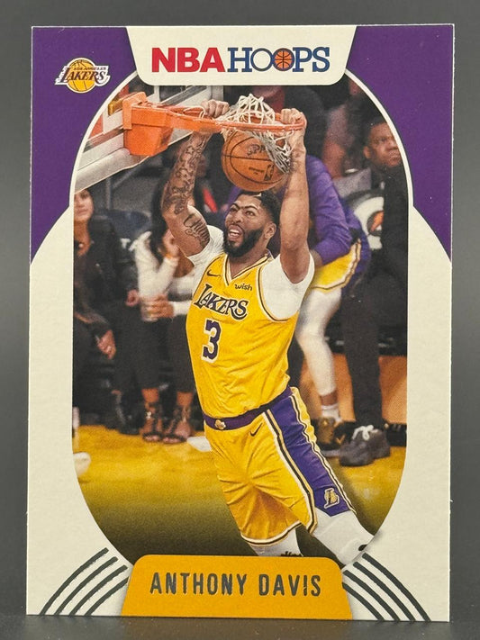 Anthony Davis 2019-20 NBA Hoops basketball card, showing him dunking in a Lakers jersey.