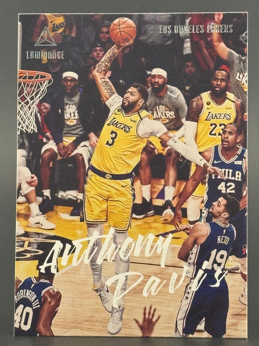 Anthony Davis 2020-21 Panini Luminance basketball card dunking in a game.