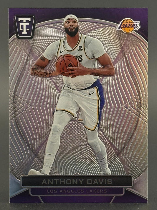 Anthony Davis Los Angeles Lakers trading card holding a basketball with a textured metallic background.