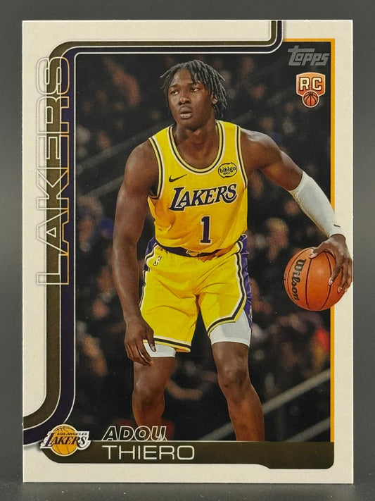 Topps RC Adou Thiero trading card featuring the Lakers player dribbling a basketball.