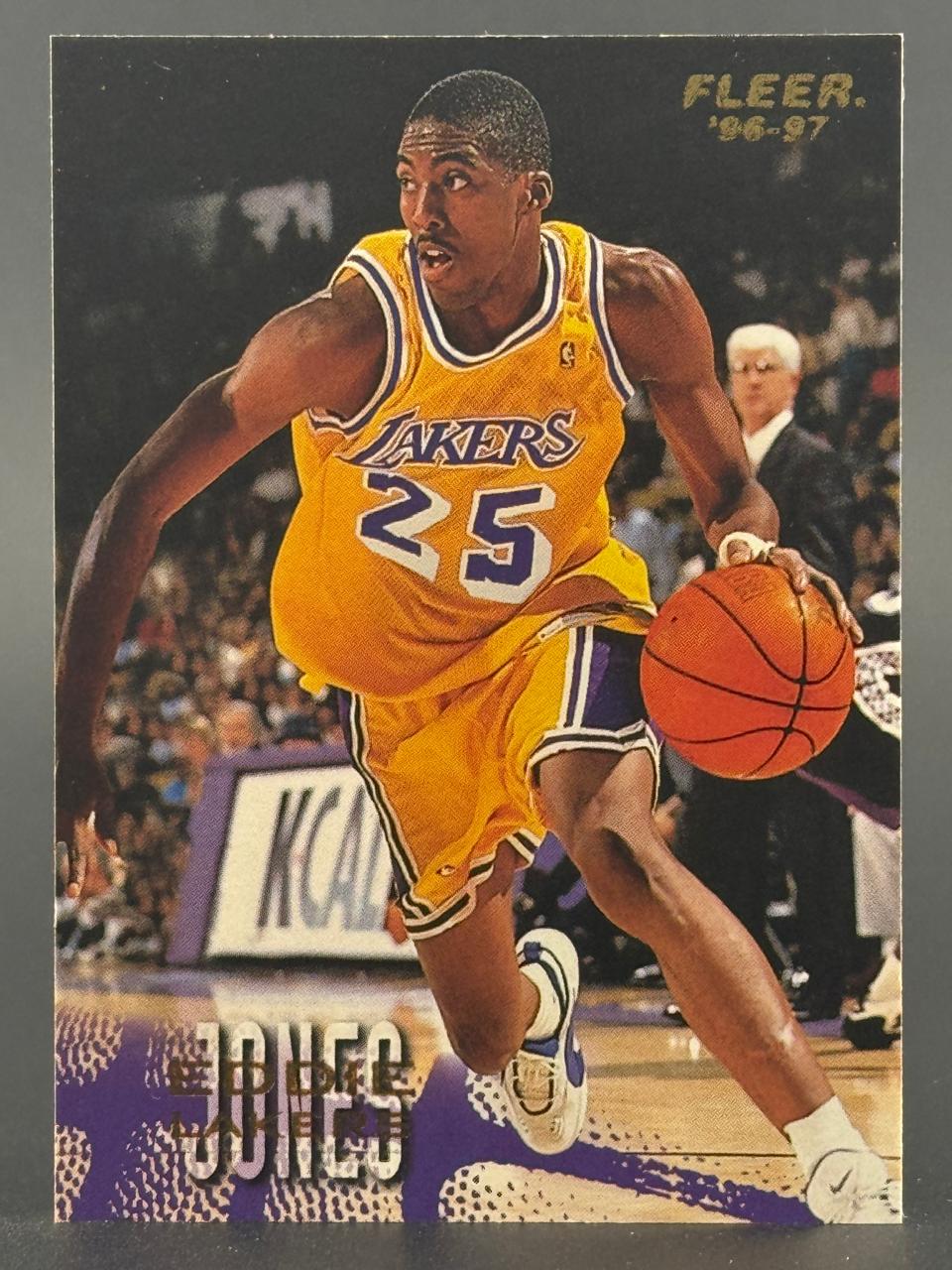 1996-97 Fleer Eddie Jones basketball card, #25, showing Jones dribbling in a Lakers uniform.