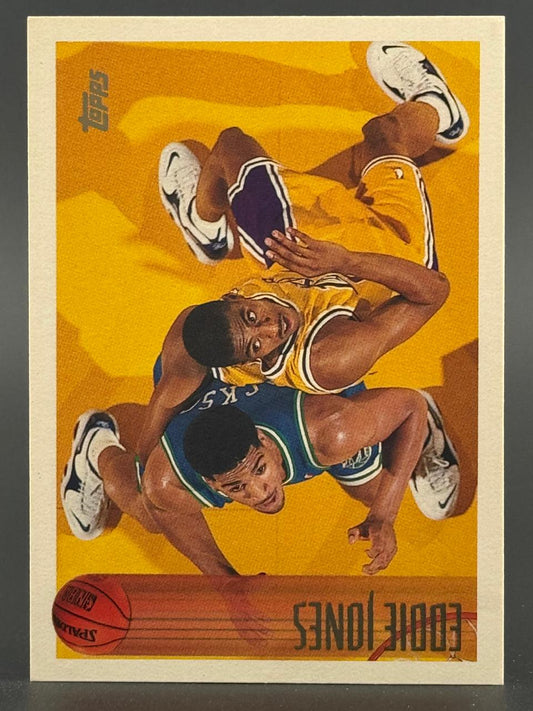 Eddie Jones Topps basketball card, showing him falling on the floor with a player.
