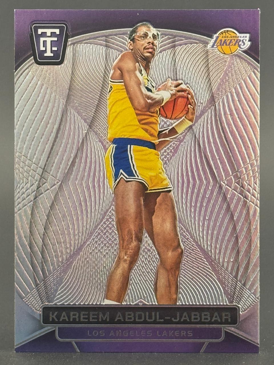 Kareem Abdul-Jabbar Los Angeles Lakers trading card holding a basketball.