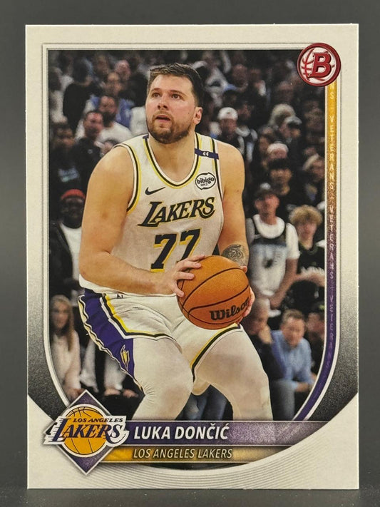 Trading card of Luka Dončić in a Los Angeles Lakers jersey holding a basketball.