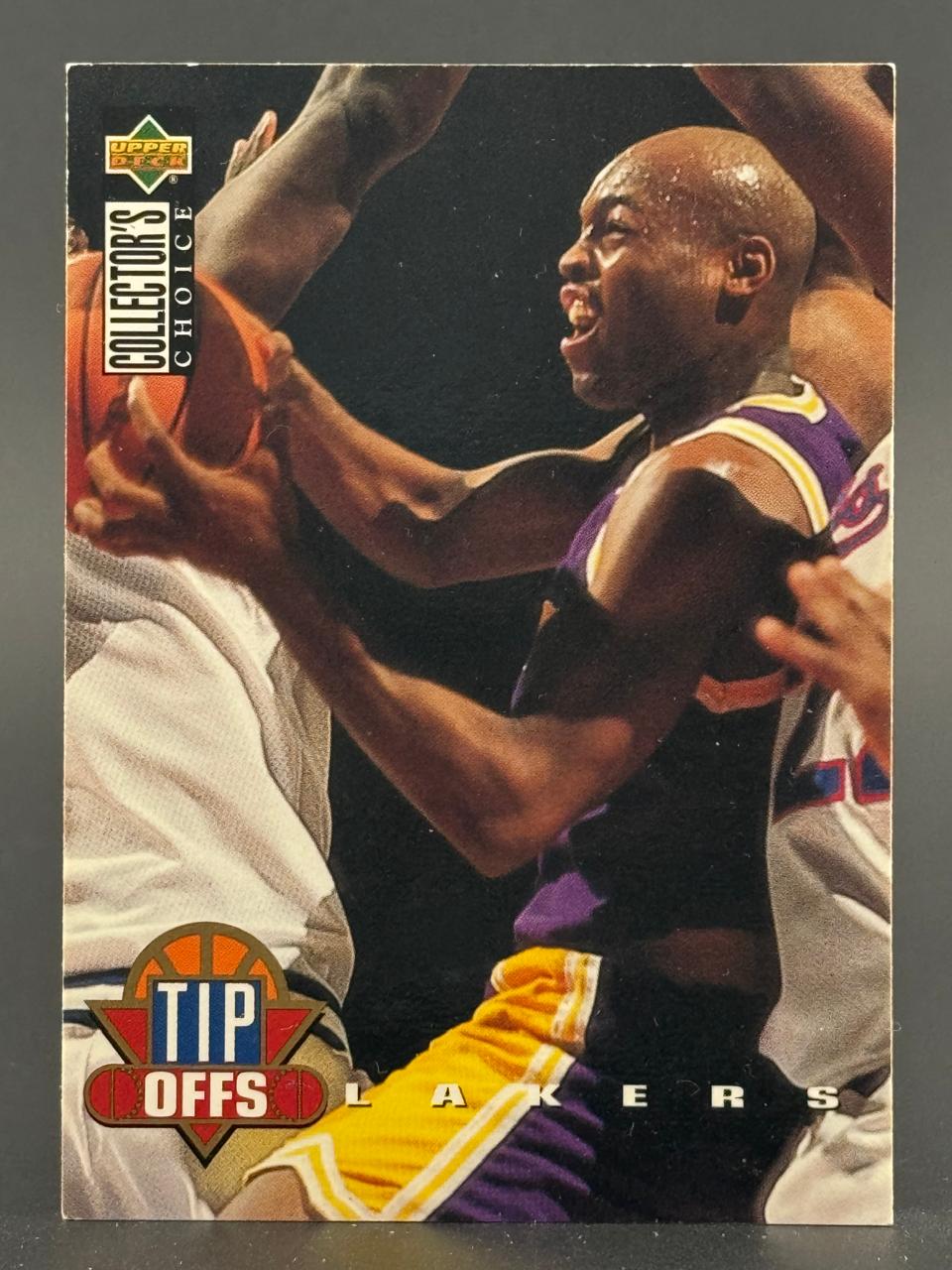 1994-95 Upper Deck Collector's Choice Tip Offs basketball card featuring a Lakers player in action.