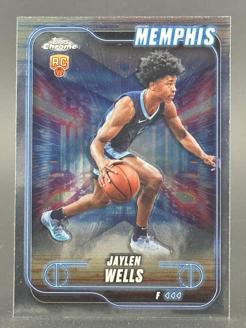 Jaylen Wells Topps Chrome rookie card featuring him dribbling in a Memphis uniform against a blue abstract background.