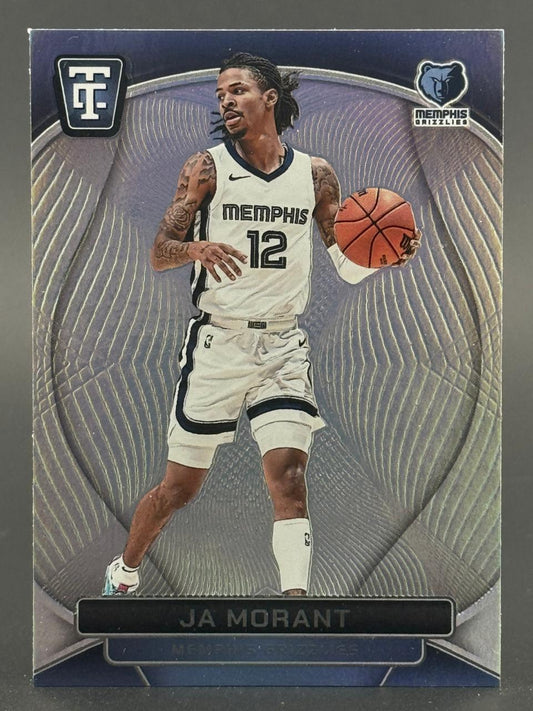 Trading card of Ja Morant in a white Memphis Grizzlies uniform dribbling a basketball against a wave pattern.