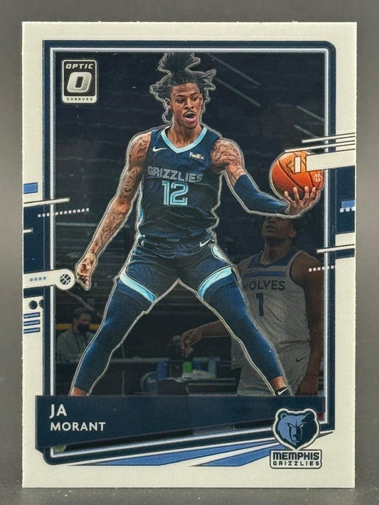 Ja Morant 2021-22 Donruss Optic basketball card featuring him in a Grizzlies uniform holding a basketball.