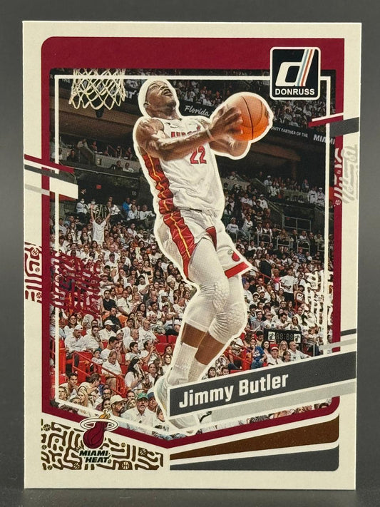 Donruss basketball trading card of Jimmy Butler in a white Miami Heat uniform shooting a jump shot.