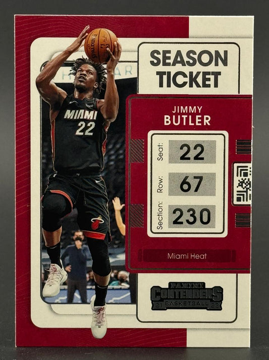 2021-22 Panini Contenders Season Ticket Jimmy Butler trading card showing him shooting a basketball in a Miami Heat uniform.