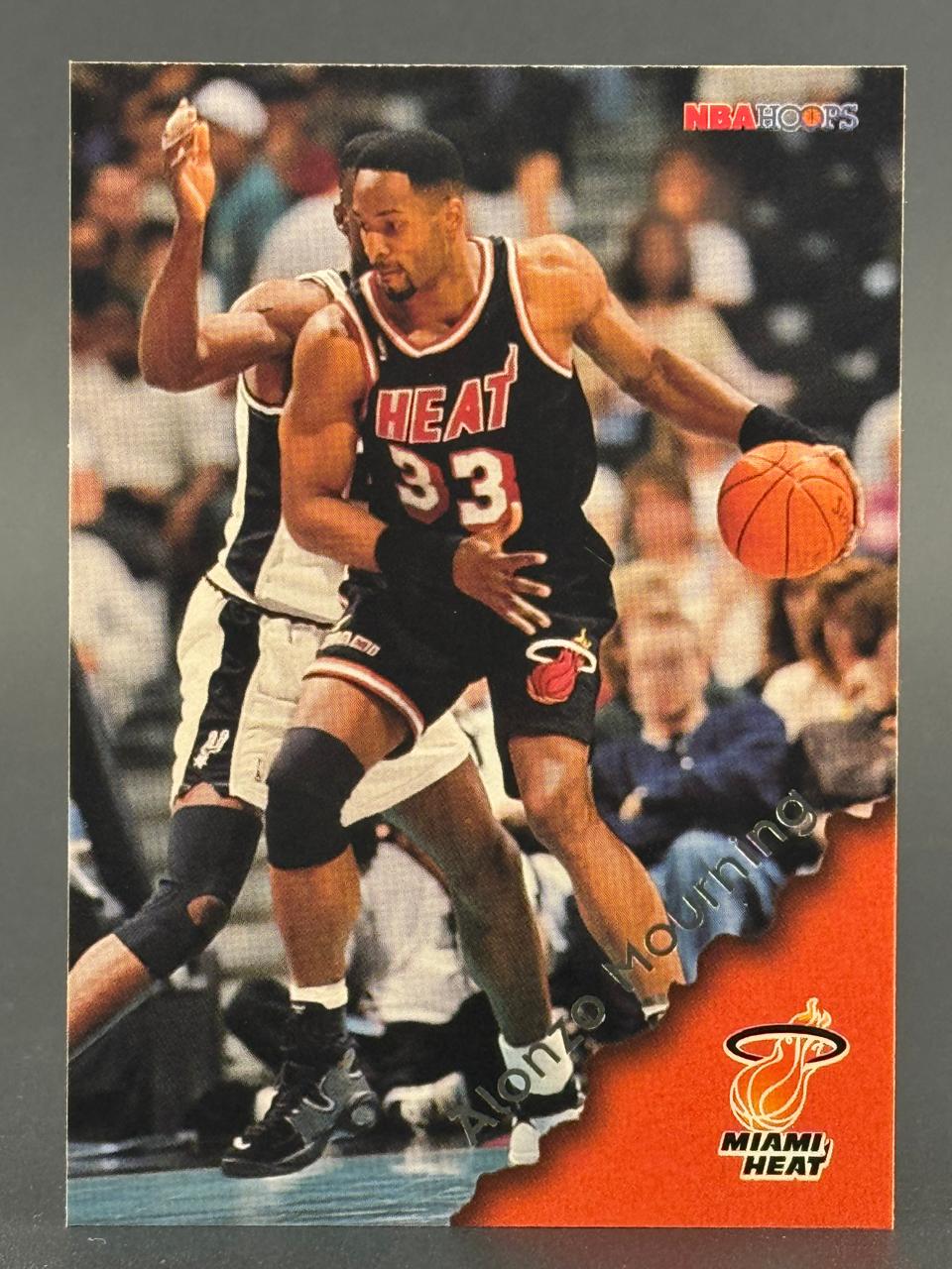 1996-97 NBA Hoops Alonzo Mourning trading card #174, featuring him dribbling in a Heat uniform.