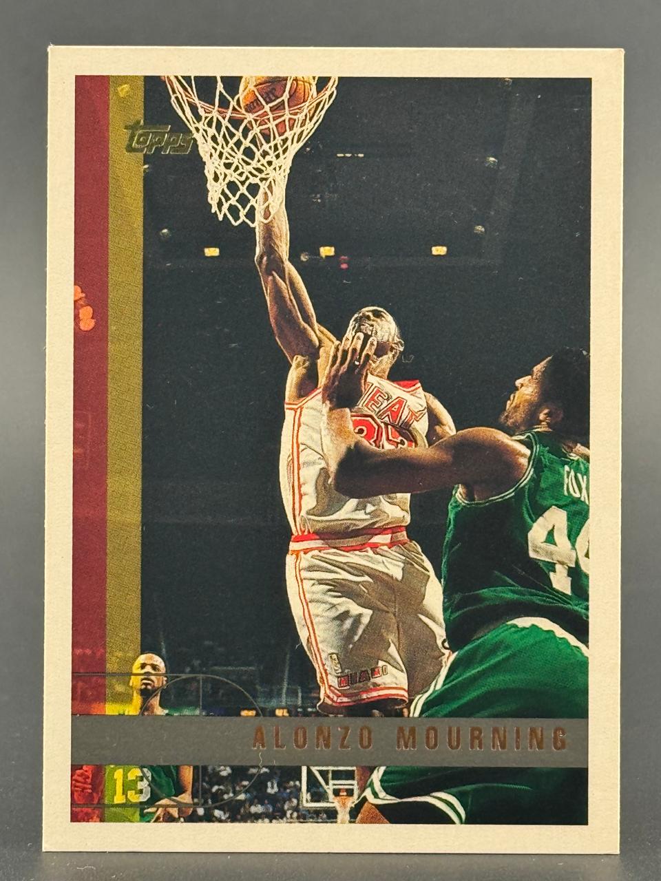 Alonzo Mourning basketball trading card, showing him dunking in a Miami Heat uniform.