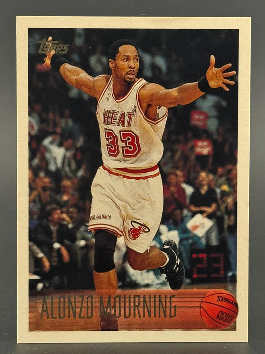 Alonzo Mourning Topps basketball card, celebrating with arms wide on court.