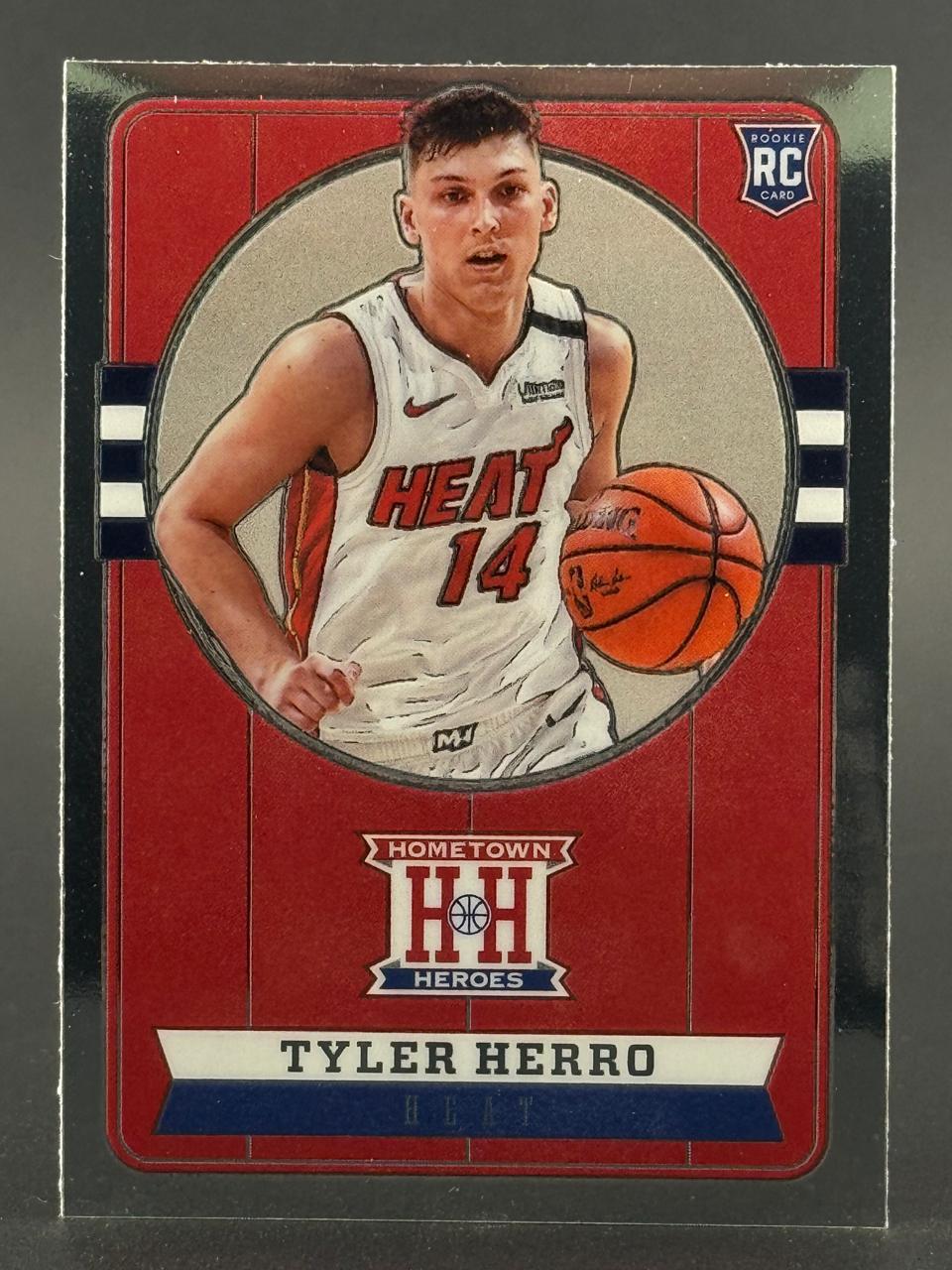 Tyler Herro Hometown Heroes rookie trading card, depicting him in a Miami Heat uniform dribbling a basketball.