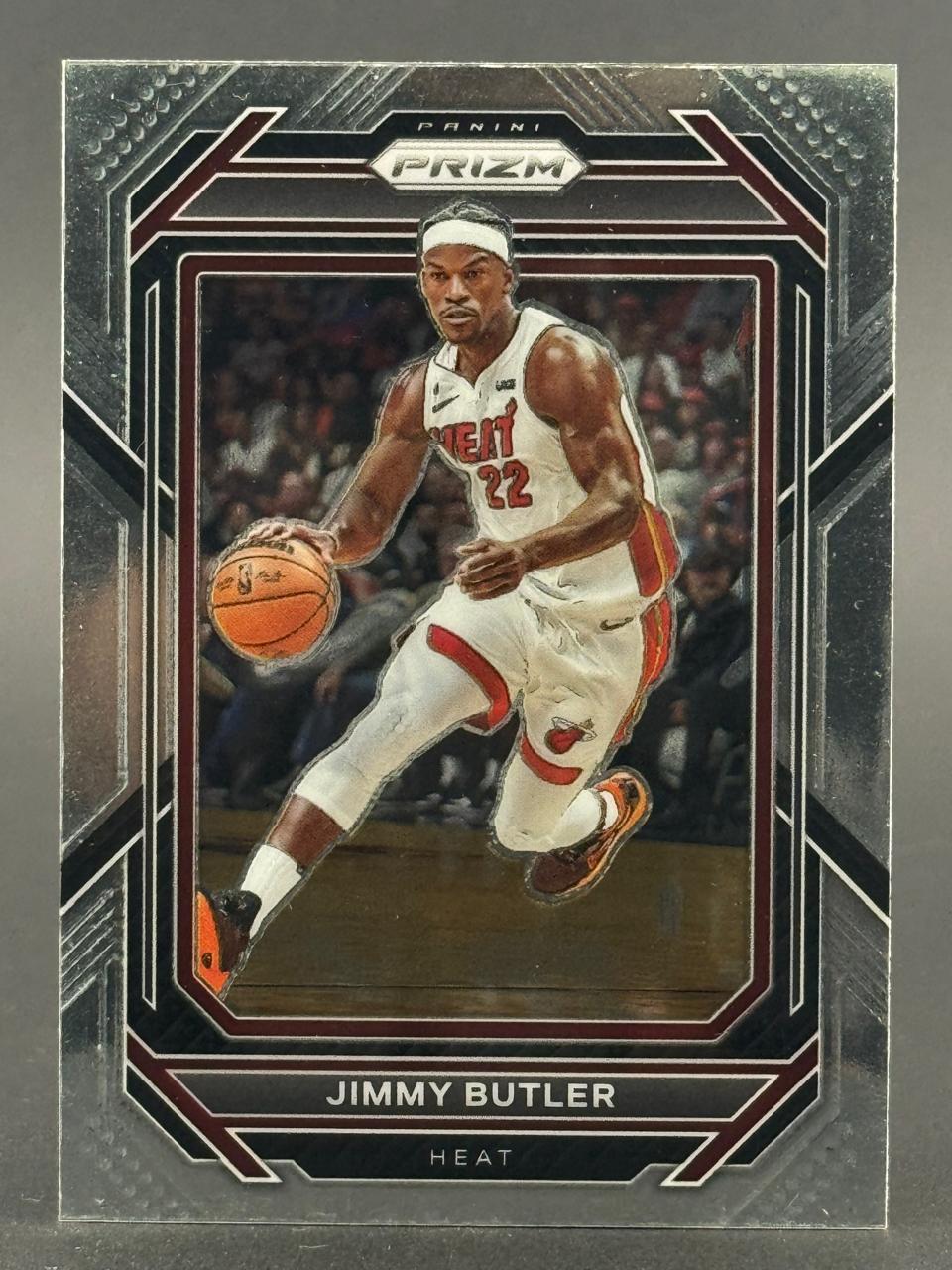 Jimmy Butler Panini Prizm basketball card, showing him dribbling in a Miami Heat uniform.