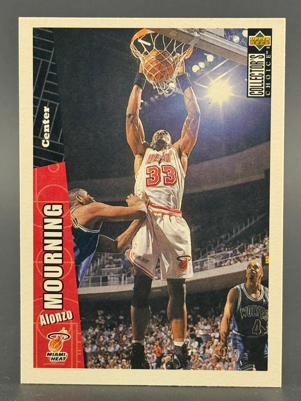 1990s Alonzo Mourning Miami Heat basketball card by Upper Deck Collector's Choice, showing him dunking.