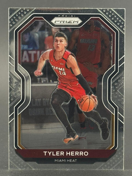 Tyler Herro 2020 Panini Prizm trading card dribbling a basketball in a Miami Heat uniform.