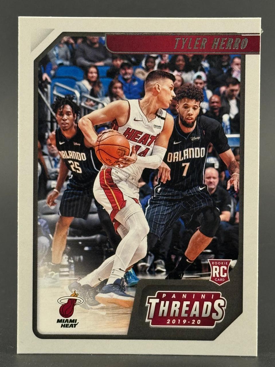 2019-20 Panini Threads Tyler Herro rookie basketball card, featuring Herro dribbling against Orlando defenders.