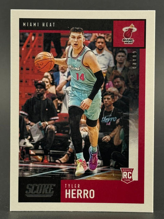 Tyler Herro 2019-20 Score basketball card featuring him dribbling in a teal Miami Heat uniform.