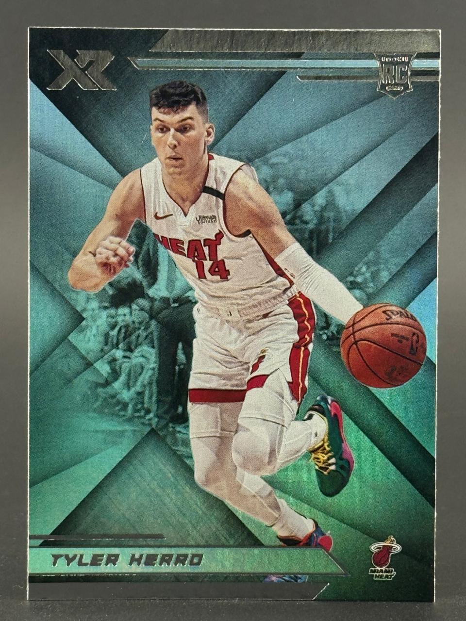 2019-20 Panini XR Tyler Herro rookie card #14 in Miami Heat uniform dribbling a basketball.