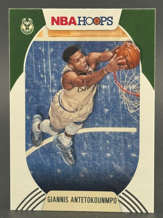 Giannis Antetokounmpo NBA Hoops trading card featuring an overhead action shot of him dunking.