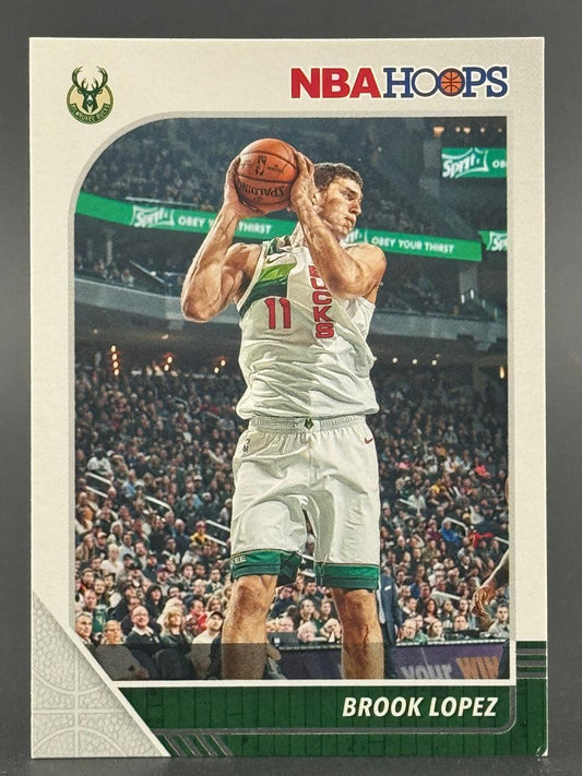 Trading card of Brook Lopez, Milwaukee Bucks, holding a basketball, from NBA Hoops.