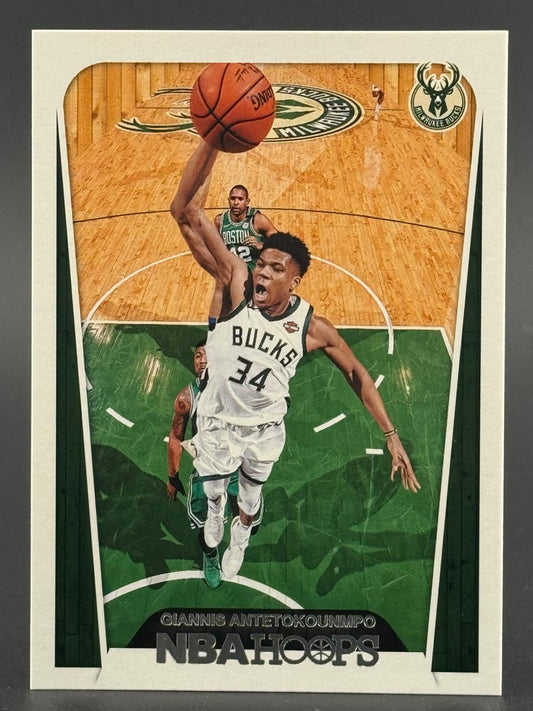 Giannis Antetokounmpo NBA Hoops basketball card featuring him dunking in a Bucks uniform.