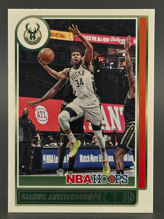 Giannis Antetokounmpo trading card, NBA Hoops, driving to the basket in Bucks jersey.