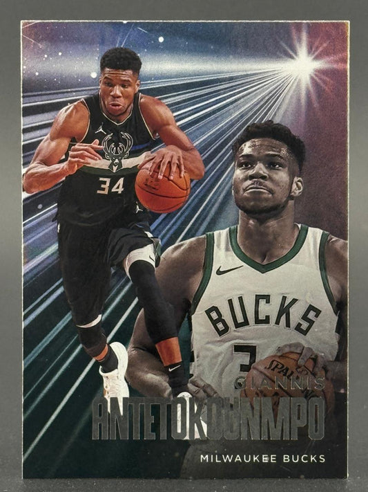 Giannis Antetokounmpo Milwaukee Bucks trading card showing him dribbling, with a large portrait and light beams.