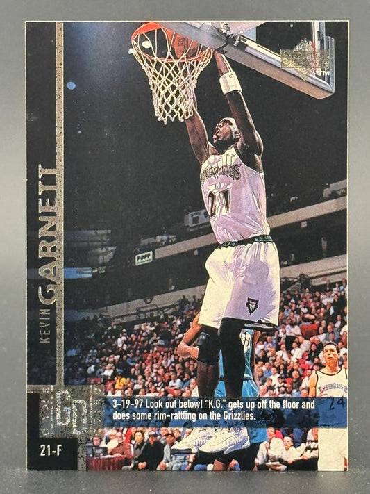 Trading card of Kevin Garnett dunking, featuring a caption about the 3-19-97 game against the Grizzlies.