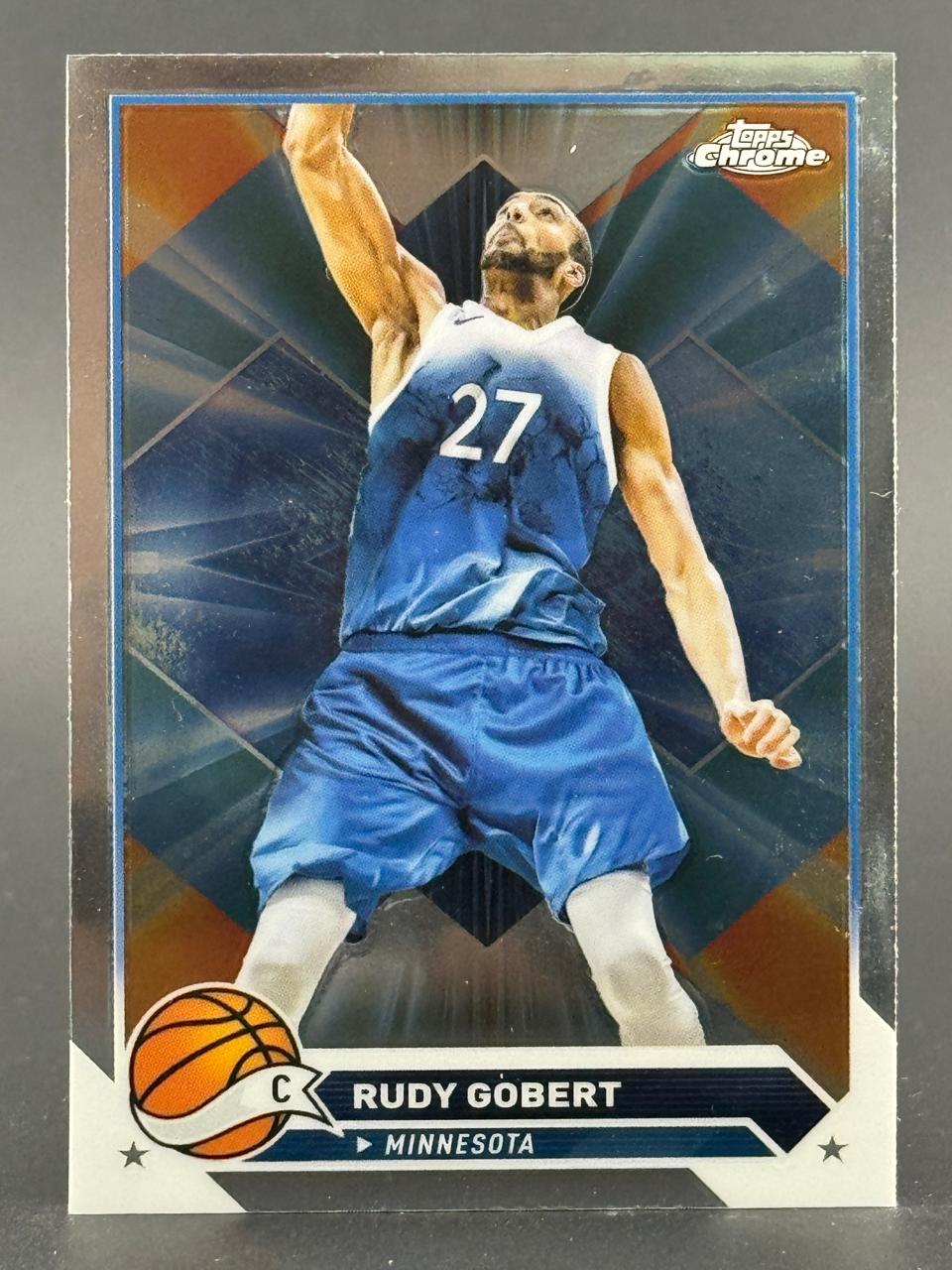 Rudy Gobert basketball trading card, Topps Chrome, showing him in a blue and white jersey with number 27.
