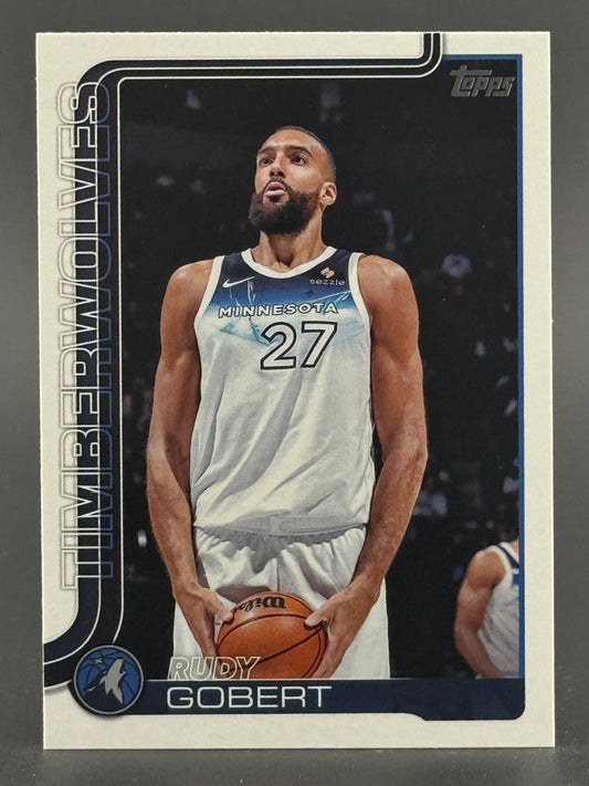 Rudy Gobert Topps trading card featuring the Timberwolves center holding a basketball in a white jersey.
